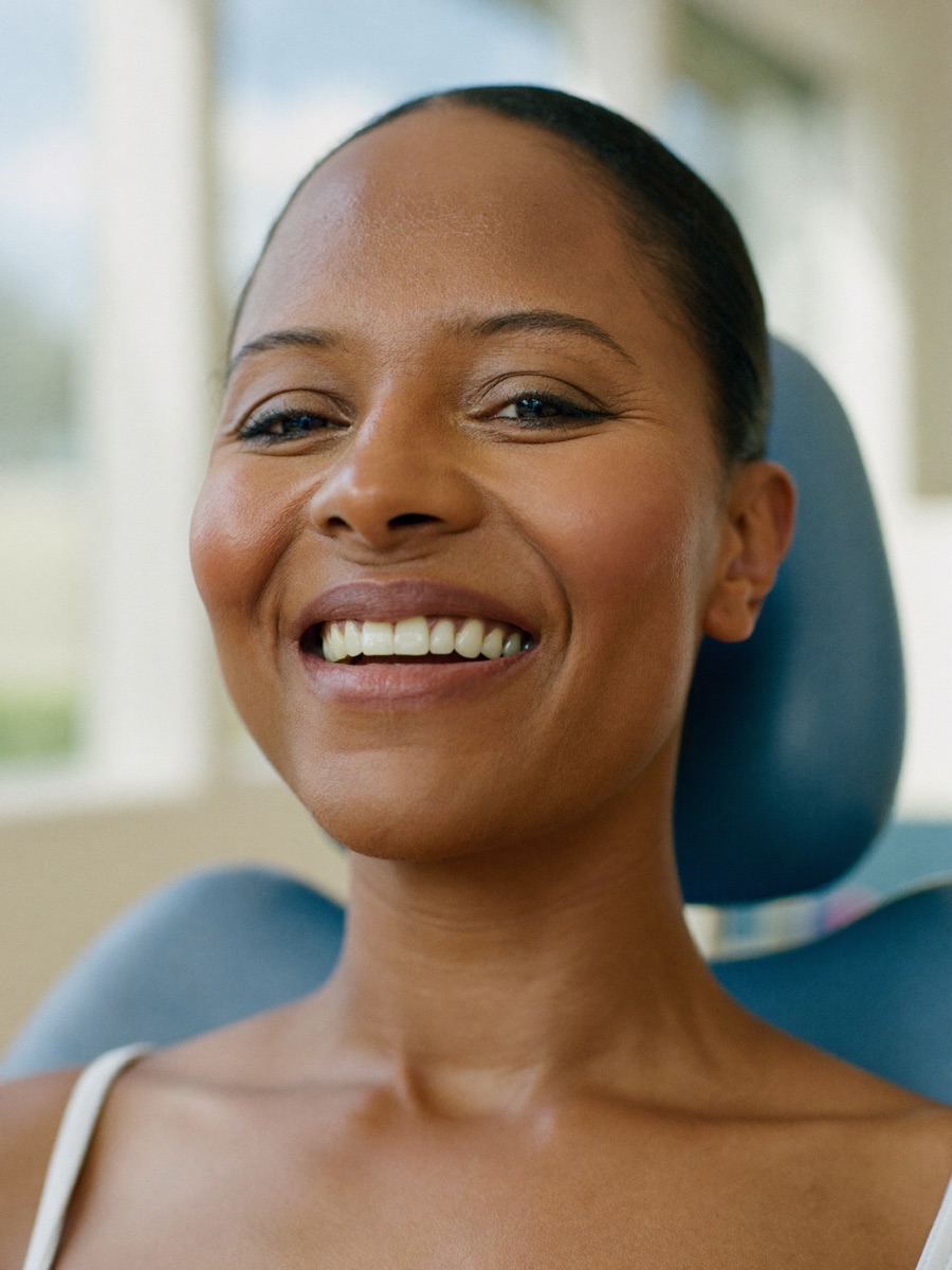 A patient smiling confidently