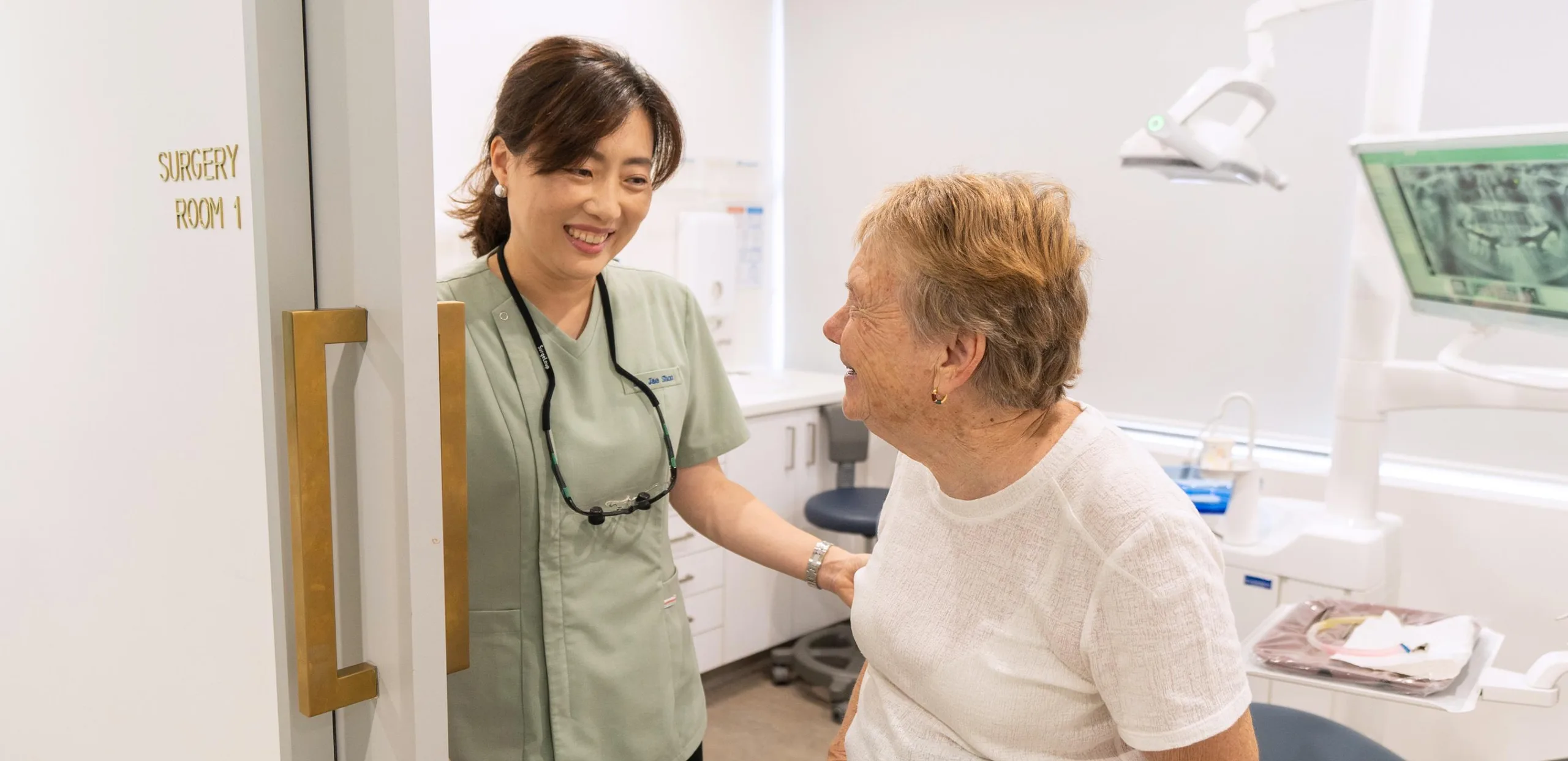 Dr Jae warmly welcoming an older patient at Mirabel Dental Hornsby