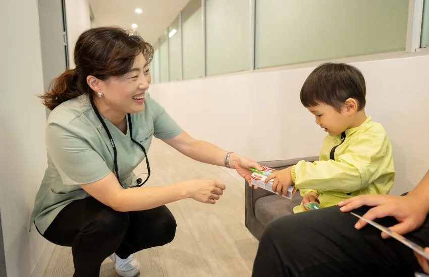 A Mirabel Dental Hornsby dentist sharing a kind moment with a young patient